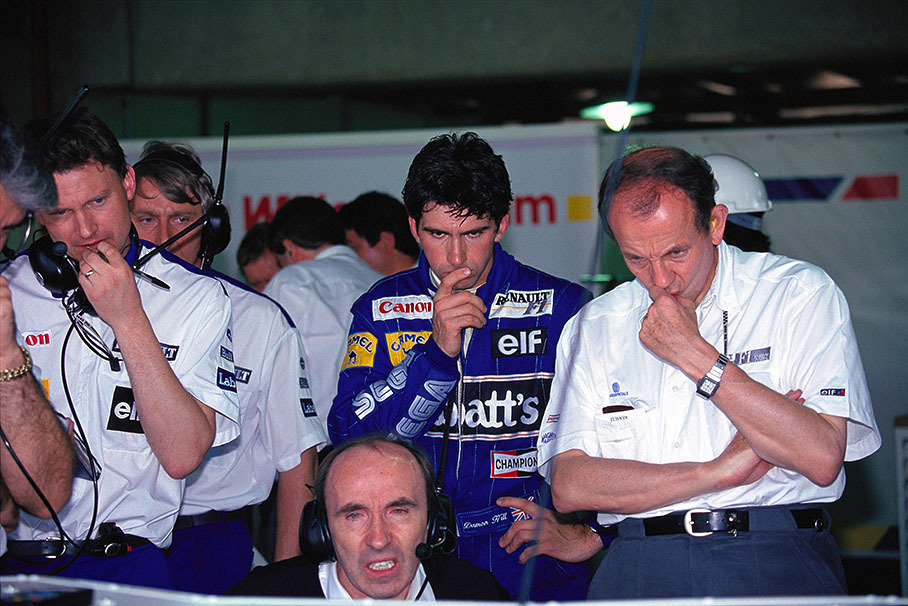 Damon Hill watching the classification times with his boss and the engineers in the Williams pits
