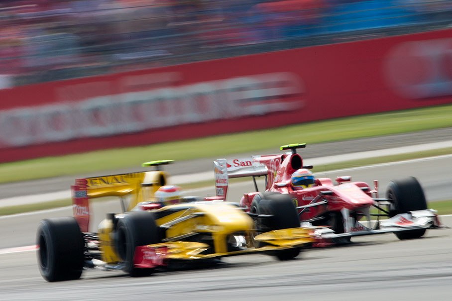 Ferrari's Alonso tries to get pass Petrov's Renault