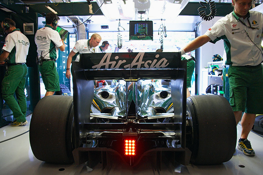 Trulli returns to Lotus pits after a few laps in practice