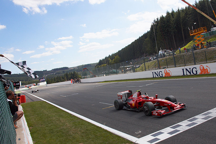 Race winner Kimi Raikkonen crosses the finish line