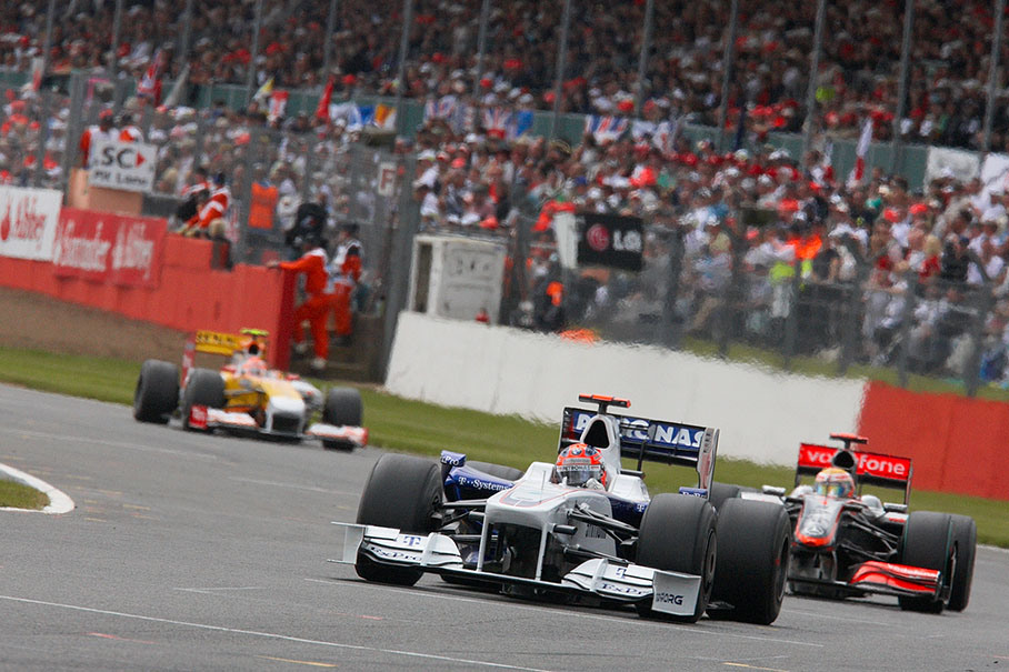 Robert Kubica on BMW Sauber in front of Hamilton and Piquet