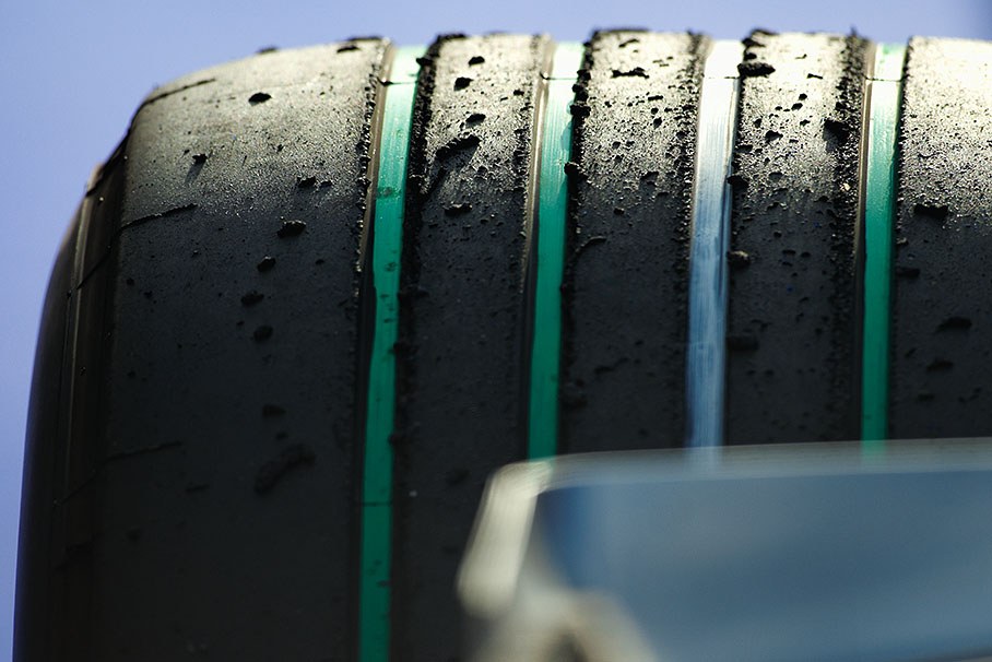 Formula One racing shows its support for the FIA's Make Cars Green campaign by running on unique green-grooved tyres