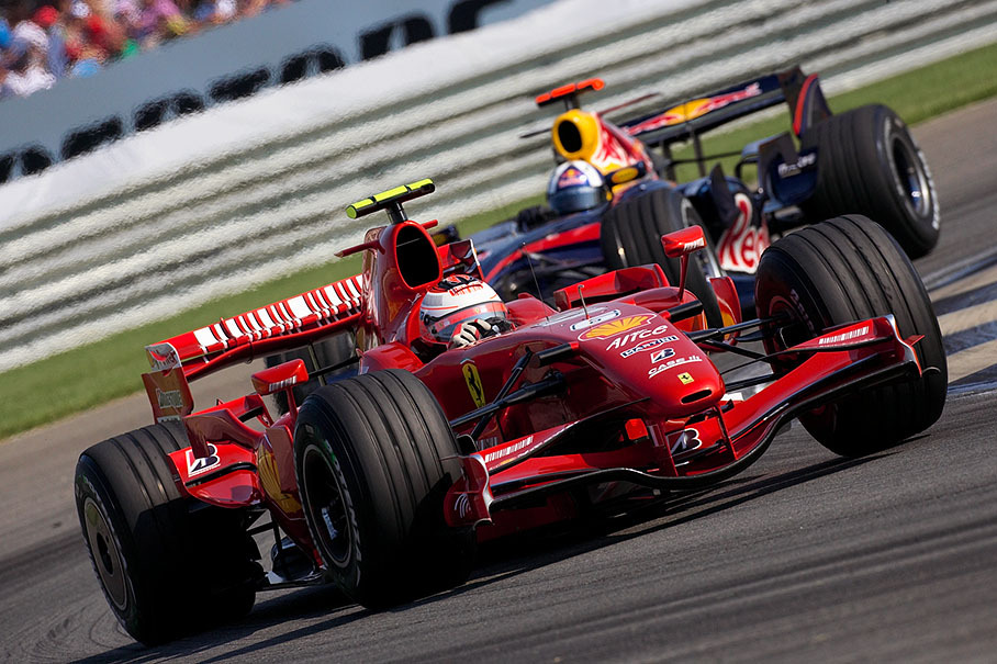 Ferrari's Kimi Raikkonen in front of Coulthard
