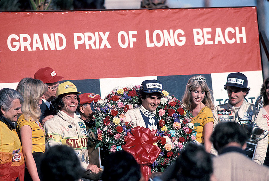 Podium ceremony after the 1980 US GP (West) Long Beach: third placed Emerson Fittipaldi, race winner Nelson Piquet and second placed Riccardo Patrese