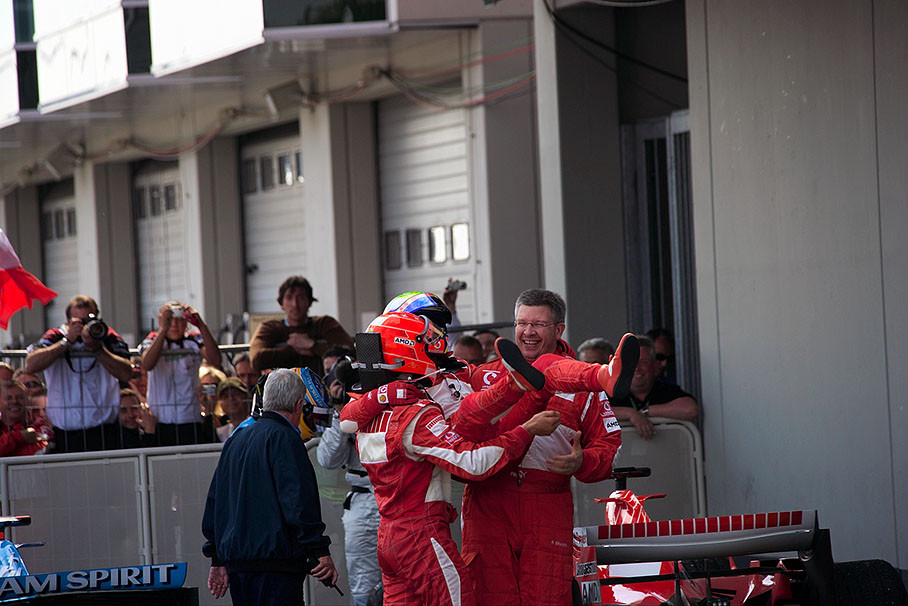 Felipe Massa lifted by Michael Schumacher and Ross Brawn