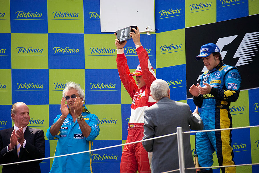 Michael Schumacher present his trophy for second place