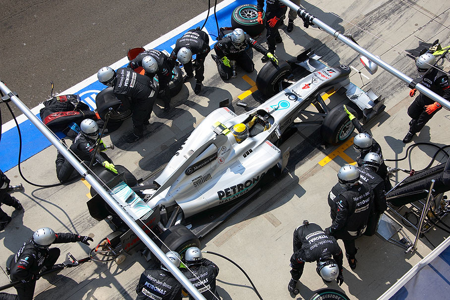 Nico Rosberg stops at Mercedes GP pits, his right rear wheel still not ready