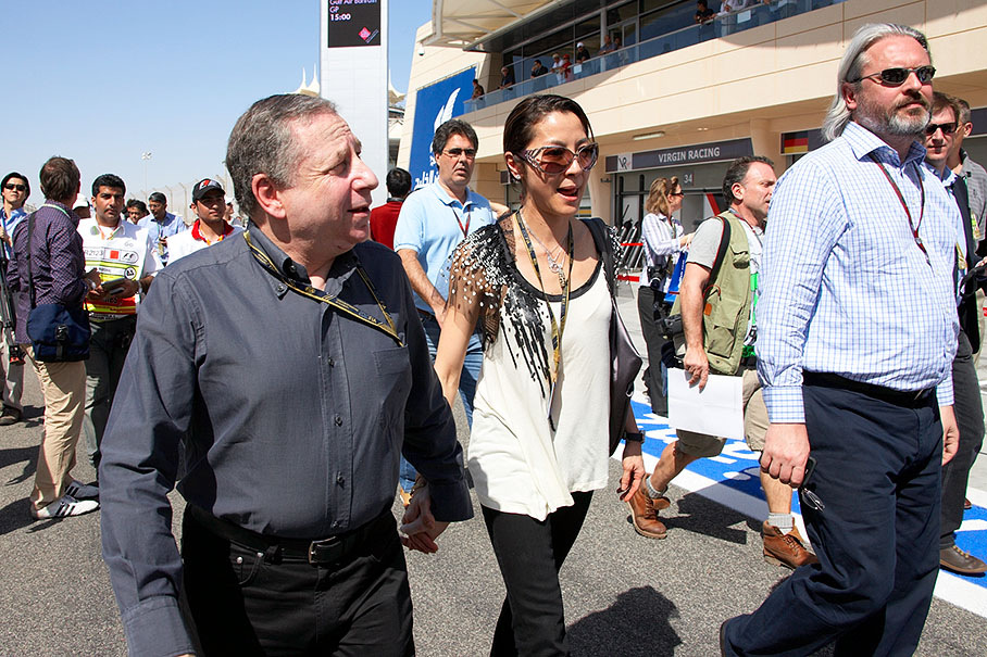 FIA president Jean Todt and his wife Michelle Yeoh do a pitwalk with FIA spokesman Richard Woods