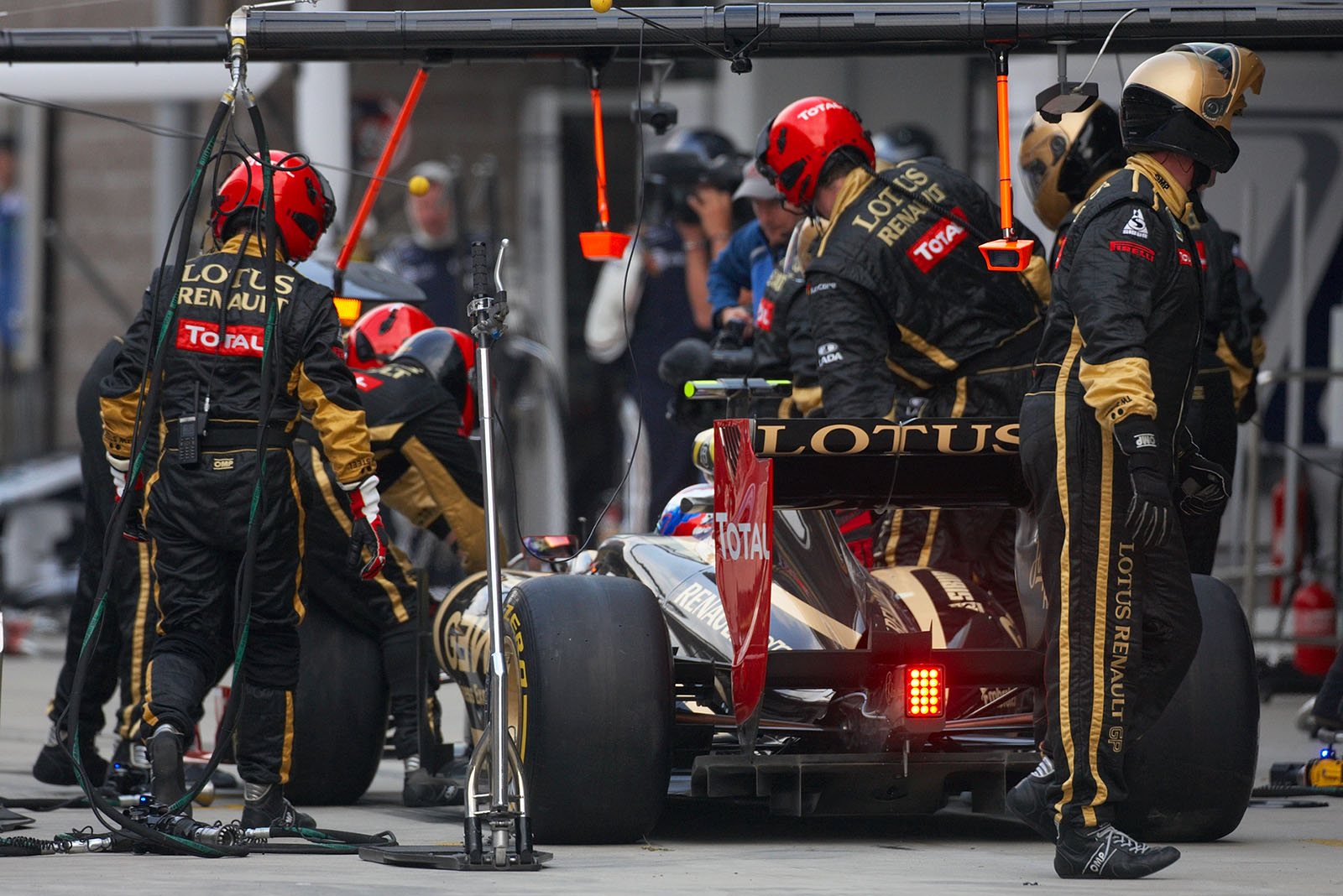 Pit stop of Vitaly Petrov at Lotus Renault GP pits after his collision with Schumacher