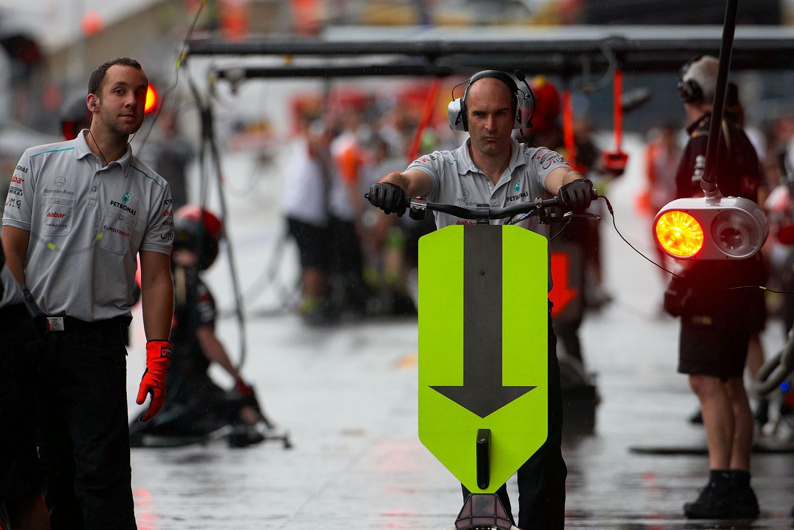 Mercedes mechanics await the race car