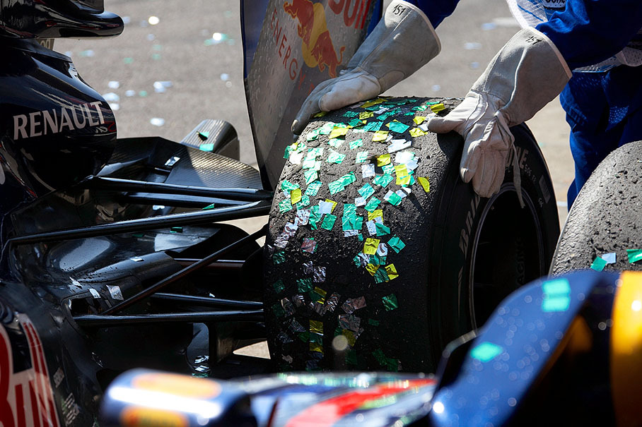 Glitter from podium ceremony on a Red Bull car's tyre