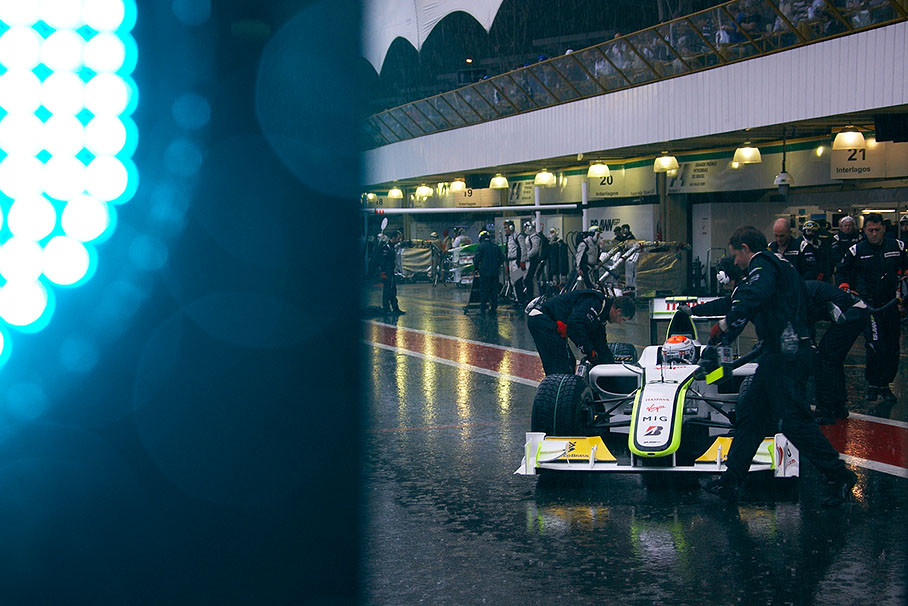 Rubens Barrichello comes to Brawn Grand Prix pits - on extreme wet tyres like his team mate
