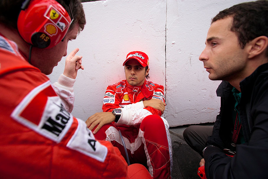 Felipe Massa and his manager Nicolas Todt listen to Ferrari race engineer Rob Smedley