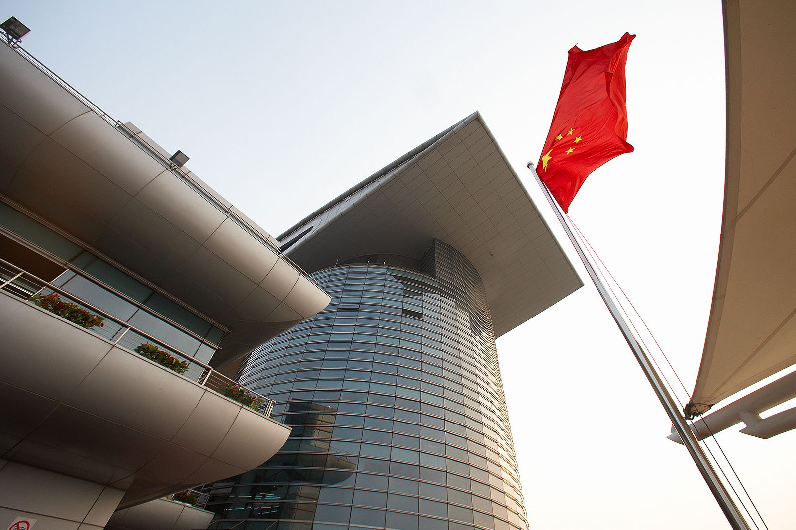 The Chinese national banner waves above the racetrack