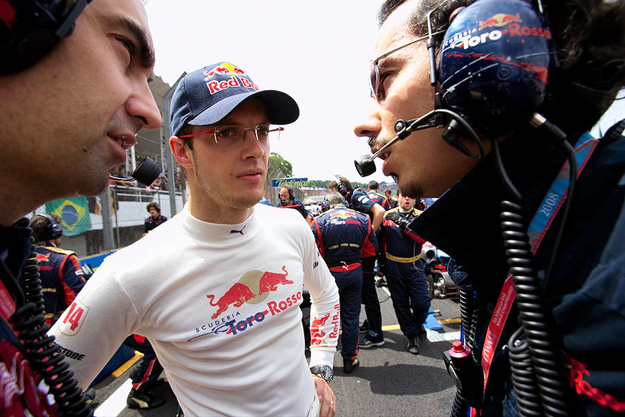 Sebastien Bourdais discusses with Toro Rosso engineers on the grid