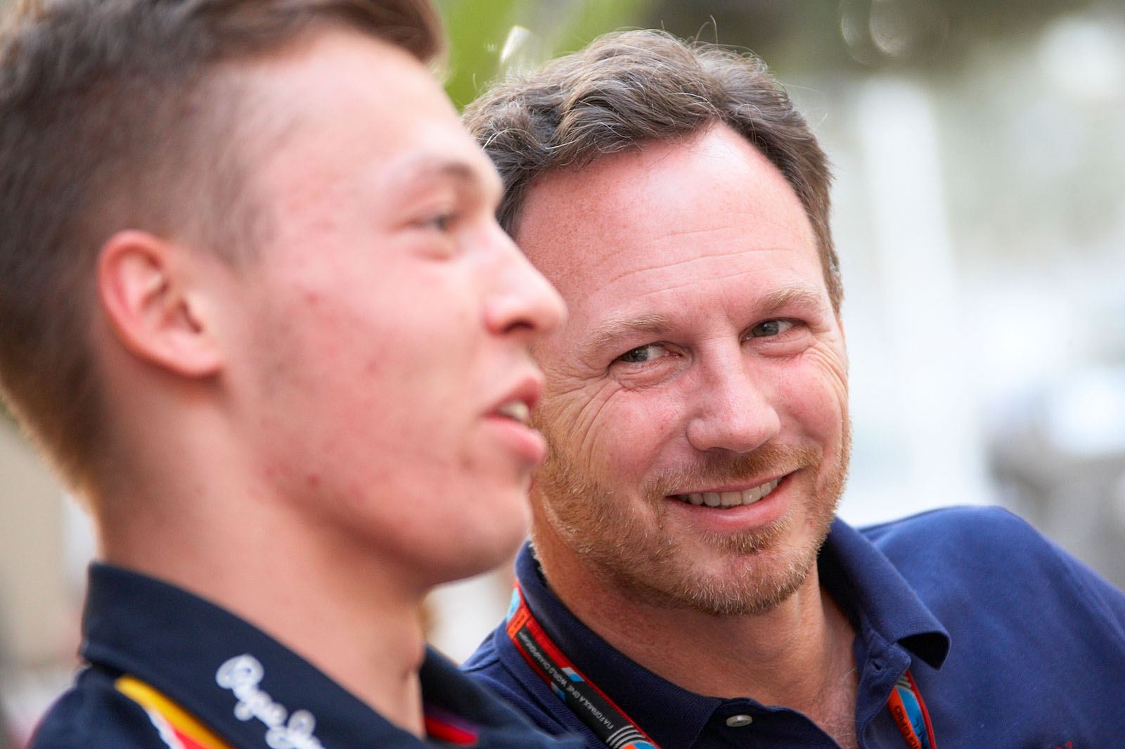 Christian Horner, team principal of the Red Bull Racing Team, looks to his driver Kvyat