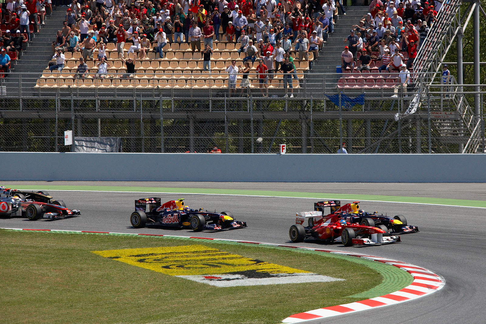 Start of the race from a different angle, Alonso takes the lead.
