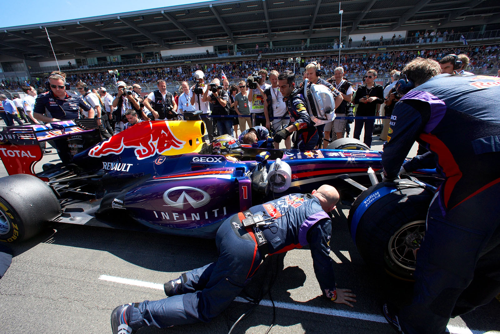 Sebastian Vettel, Red Bull Racing, is pushed to his grid position