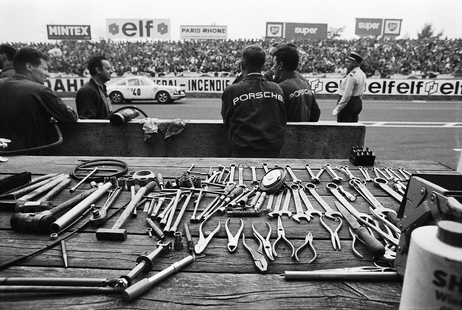 The Porsche 911T of Claude Ballot-Lena (F) and Guy Chasseuil (F) passes the Porsche pits with all tools put in order for the next operation