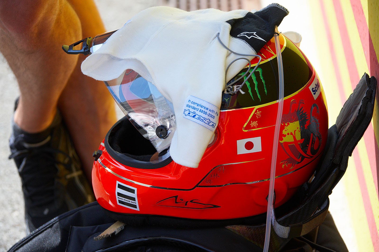 Michael Schumacher's helmet and HANS besides the grid