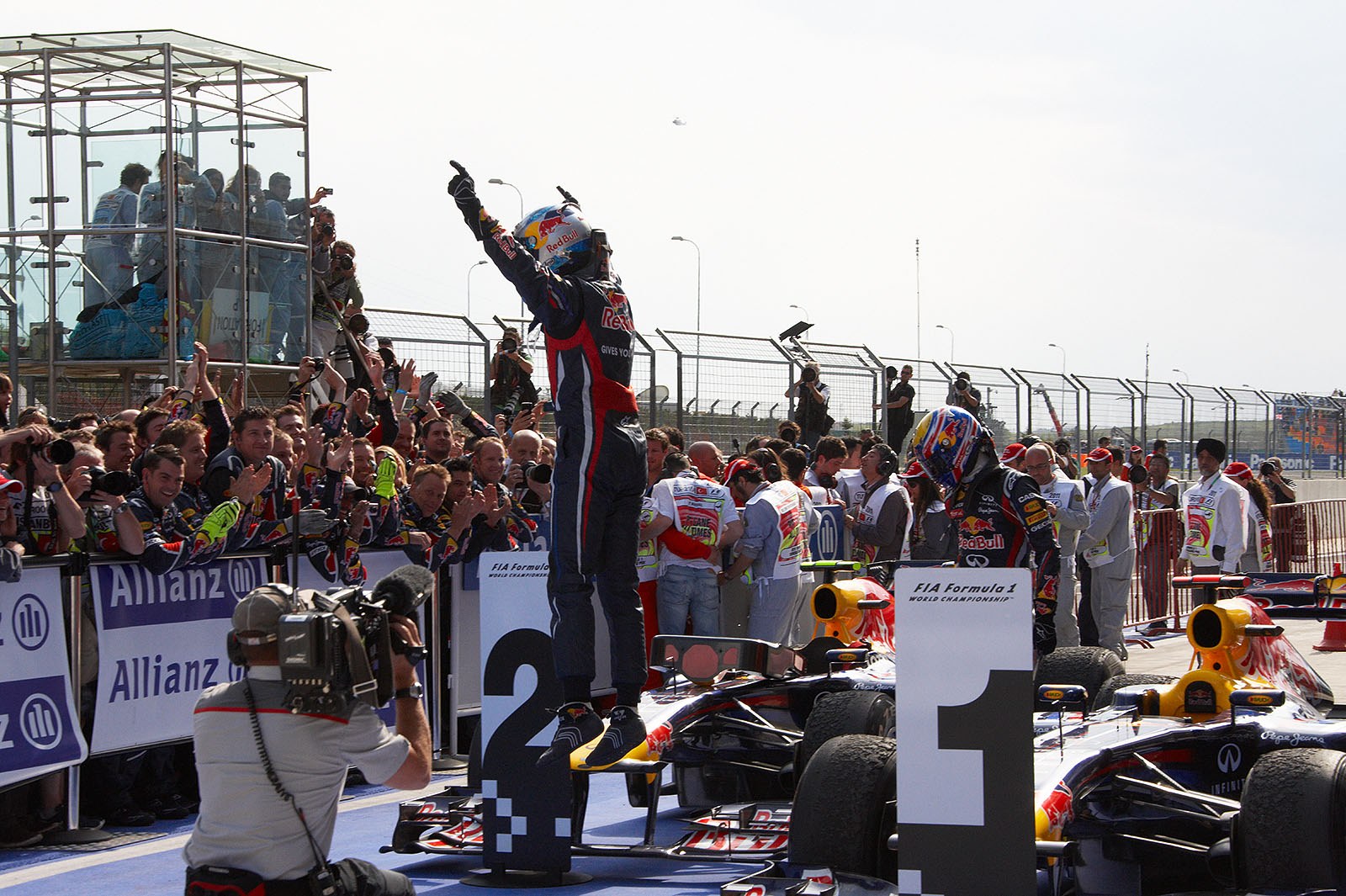 Race winner Sebastian Vettel jumps from the Red Bull-Renault car in parc ferme