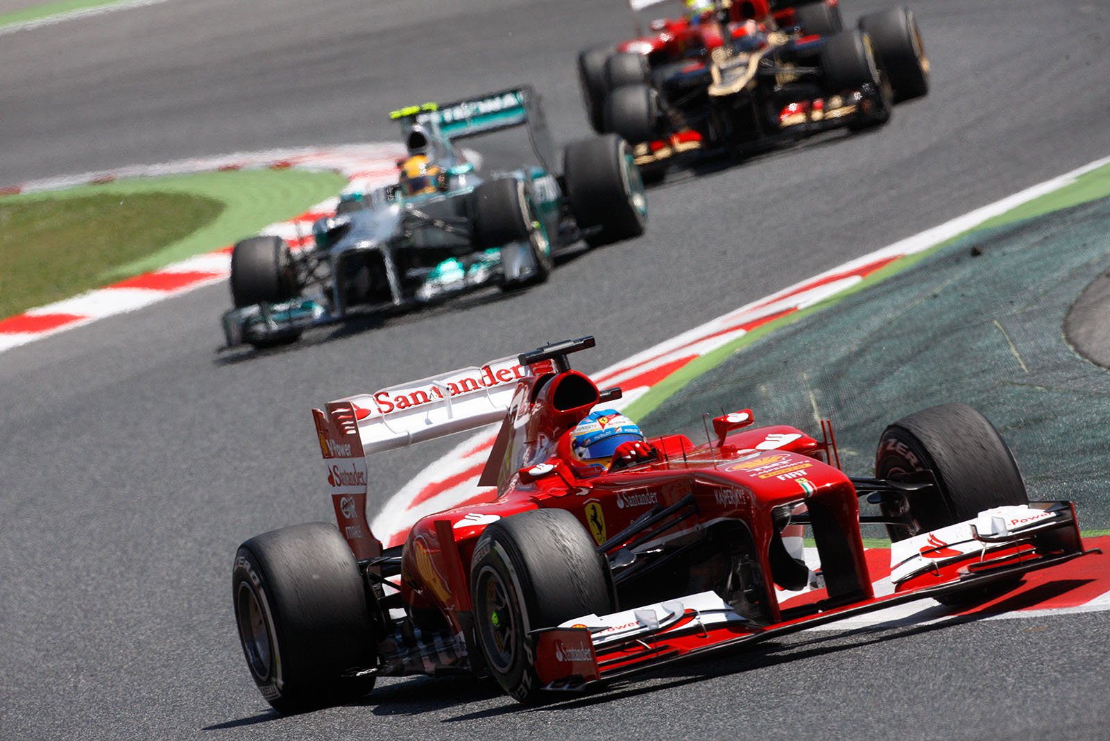 Fernando Alonso, Ferrari, after a fine start that lifted him immediately to 3rd, leads Hamilton and Raikkonen, Spanish Grand Prix, Barcelona, 2013