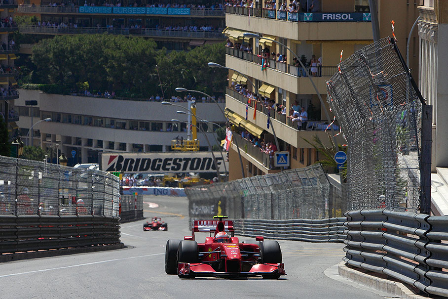 Kimi Raikkonen climbs the hill from Sainte Devote to Beau Rivage in front of Ferrari team-mate Felipe Massa