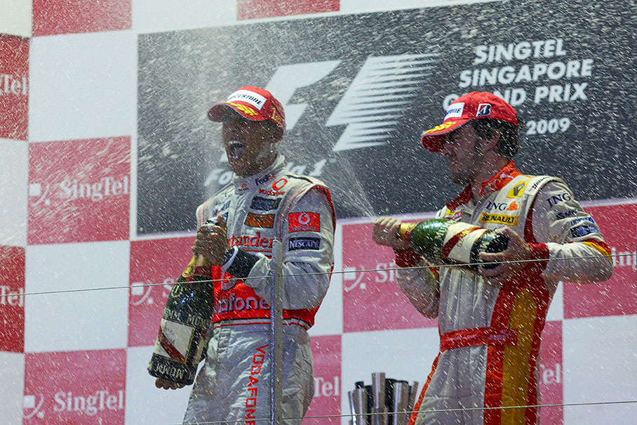 Champagne showers for winner Lewis Hamilton and third placed Alonso