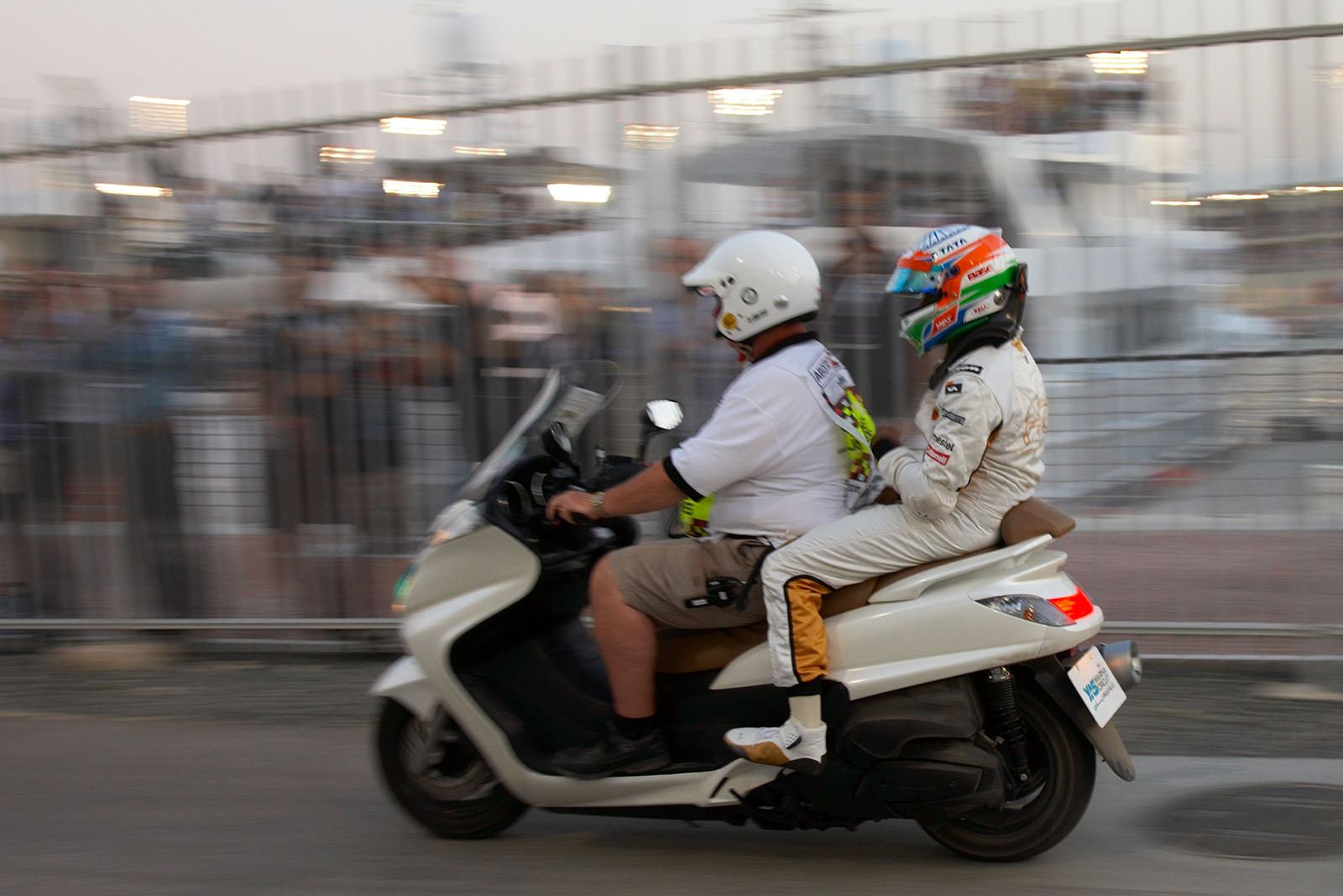 Narain Karthikeyan of HRT returns to pits after his incident with Rosberg