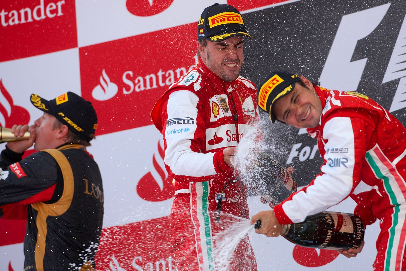 A very happy Ferrari driver Fernando Alonso joined by his team-mate Felipe Massa on the podium, Spanish Grand Prix, Barcelona, 2013