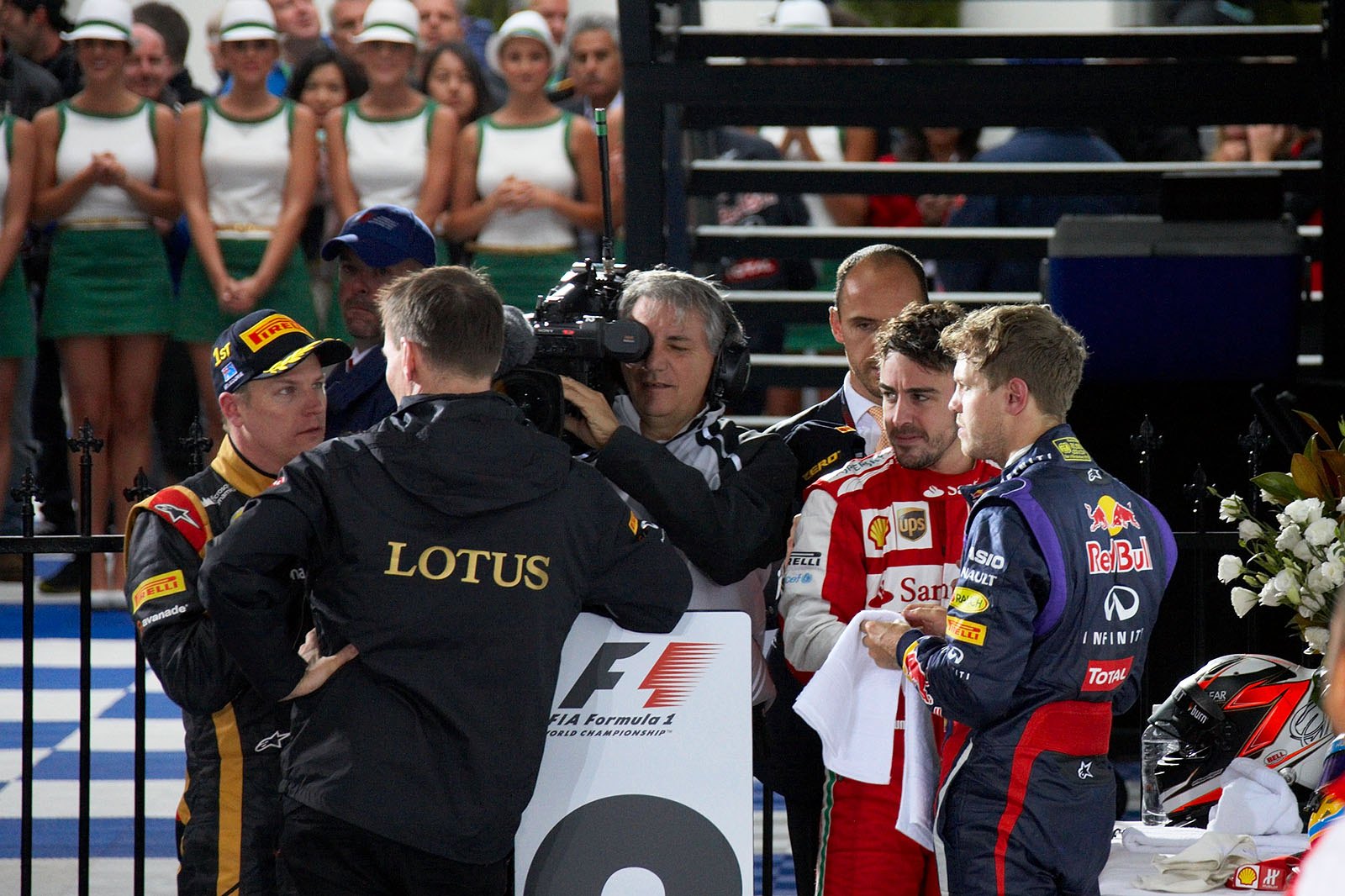 Race winner Kimi Raikkonen of Lotus celebrates with Alan Permane, Renault race engineer, in parc ferme after the victorious race
