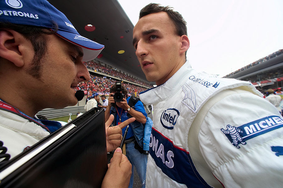 BMW Sauber's Robert Kubica on the grid with his race engineer Giampaolo Dall'Ara