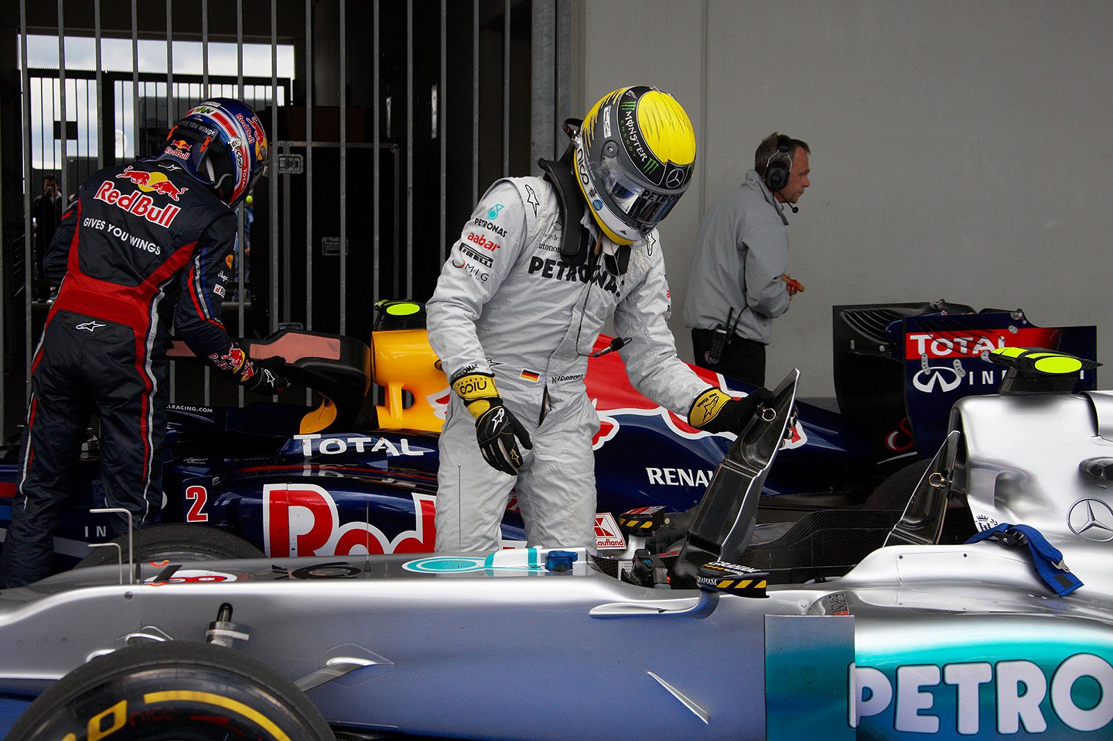 After qualifying, Nico Rosberg and Webber get out of their cars in parc ferme