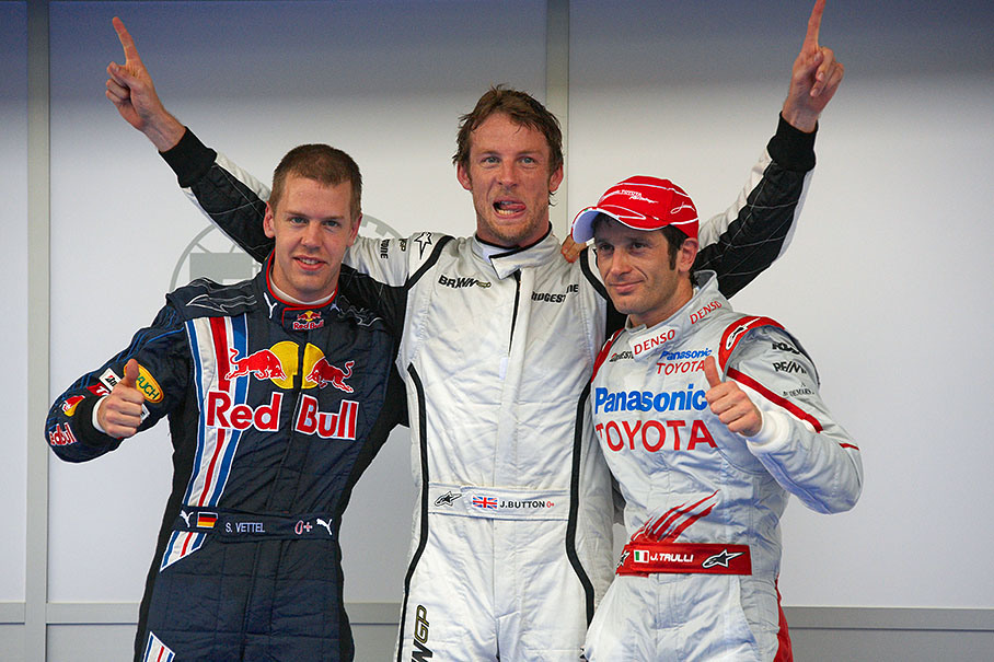 The fastest three drivers pose for the media after qualifying in parc ferme: Third positioned Sebastian Vettel of Red Bull (who is given a ten grid place penalty for accident in previous race), Brawn GPs polesitter Jenson Button and the second grid placed Jarno Trulli of Toyota