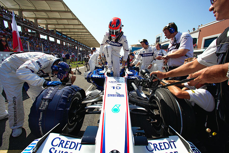 Robert Kubica climbs out of his BMW Sauber car on its grid place before the Turkish GP 2007