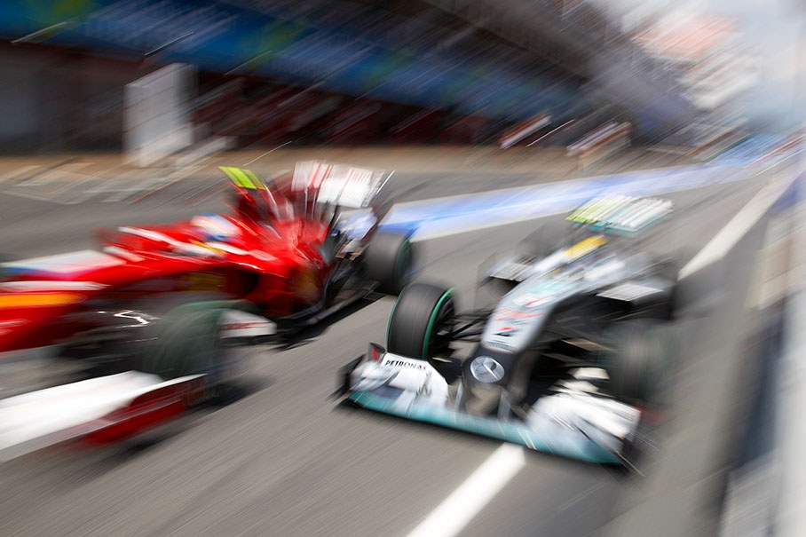 Ferrari was fined $20,000 after Fernando Alonso nearly collided in the pitlane with Mercedes driver Nico Rosberg during qualifying session