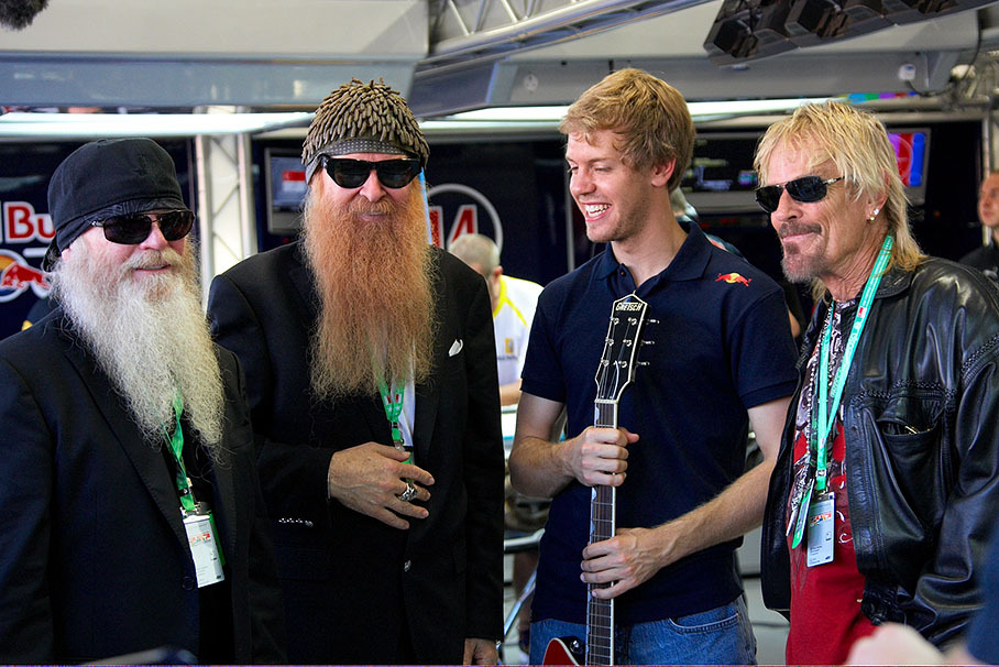 Billy Gibbons, Dusty Hill and Frank Beard of the American bluesrock band ZZ Top visit Sebastian Vettel in Red Bull pits