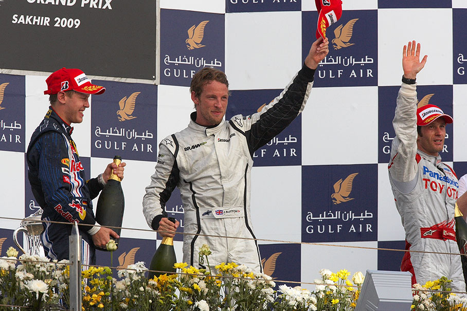 Race winner Jenson Button greets the fans after podium ceremony