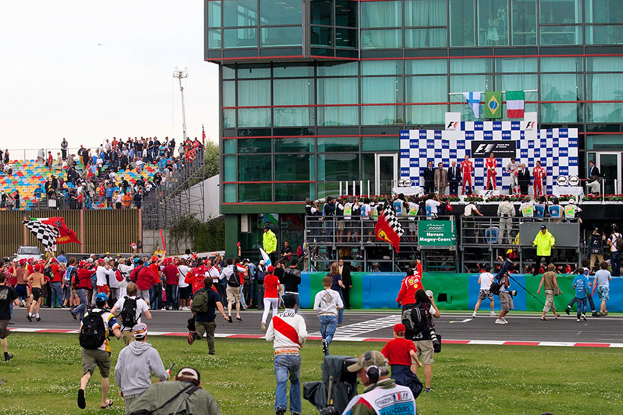 Cheering fans approach the podium ceremony