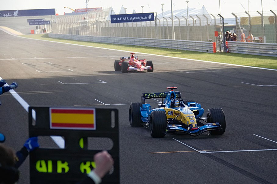 Fernando Alonso winning in front of Michael Schumacher
