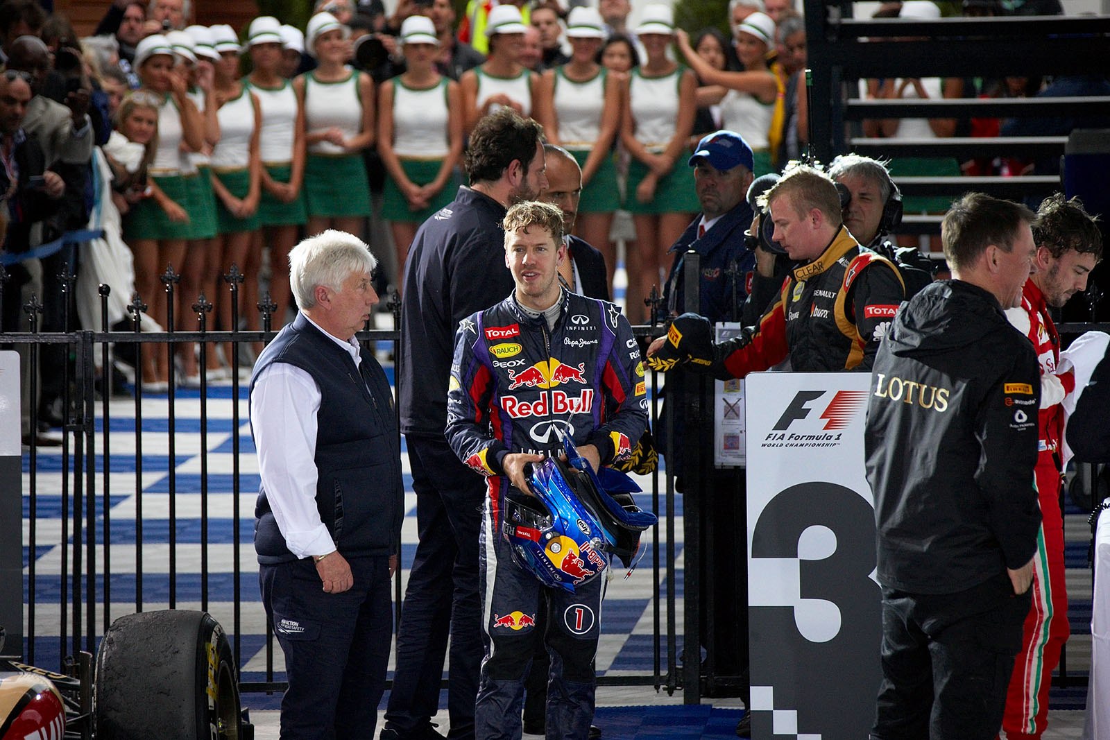 Third placed Sebastian Vettel walks through parc ferme after the race