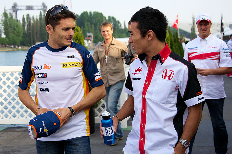 Renault's Giancarlo Fisichella and Super Aguri driver Takuma Sato