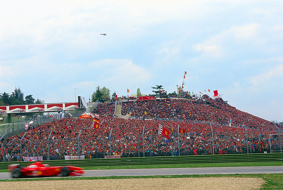Eddie Irvine, Ferrari, passes a huge crowd of tifosi