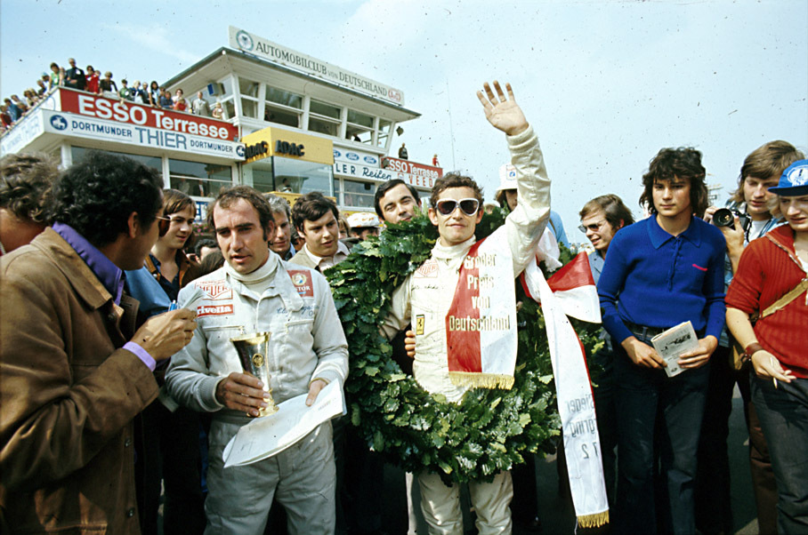 Race winner Jacky Ickx with second placed Ferrari team mate Regazzoni after winning the German GP 1972