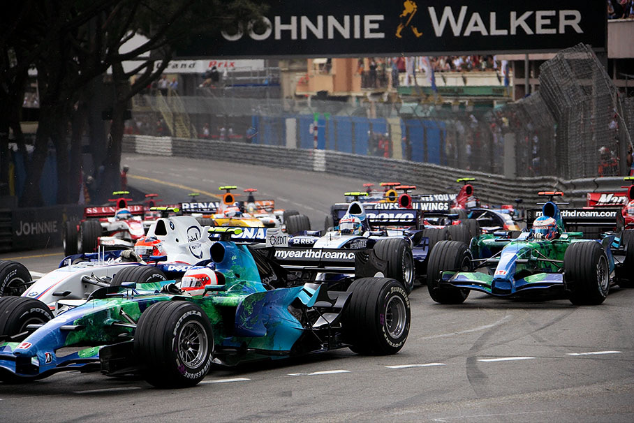 Group of cars at Ste. Devote, Barrichello in front of Kubica, Wurz and team mate Button