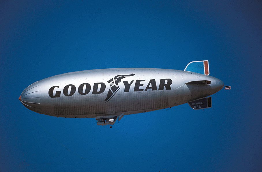 A Goodyear blimp in a blue sky above Riverside in 1973