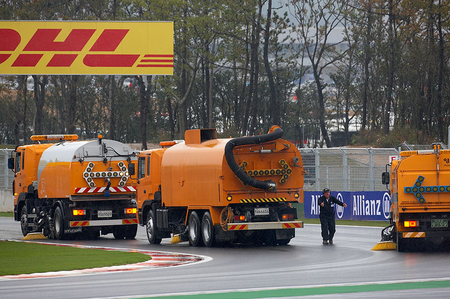 Heavy machinery is required to remove the standing water on the track