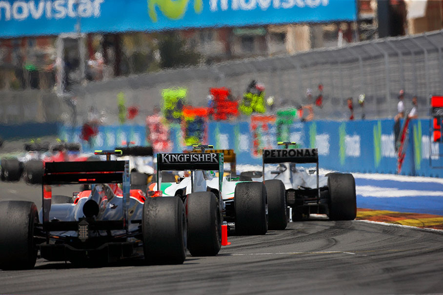 A bunch of cars turns to main straight