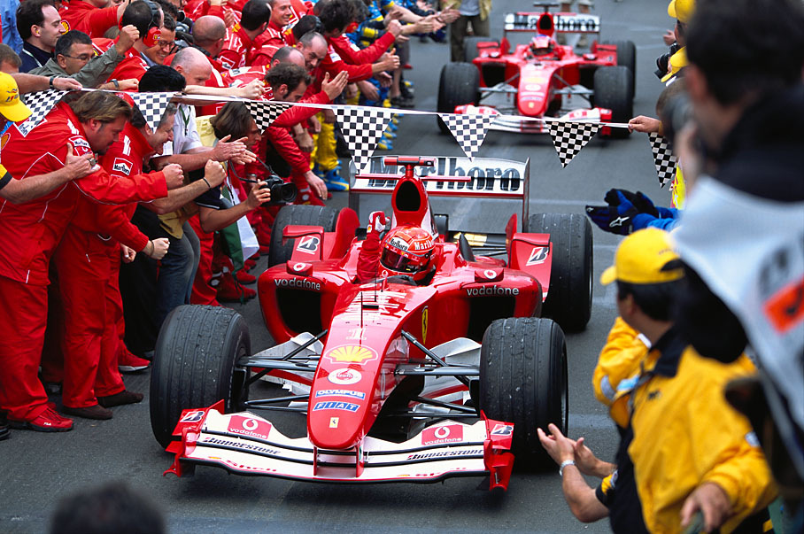 Two dominating Ferrari approaching the parc ferme