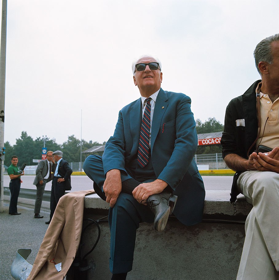 Enzo Ferrari sitting on the Monza pitwall during practice